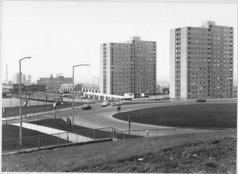A black and white image of a roundabout, with Crossbank House and Summervale House in the background.